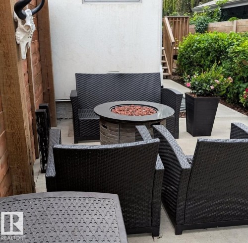 View of patio featuring an outdoor living space with a fire pit and stairs - 14812 98 Avenue, Edmonton, AB - Outdoor