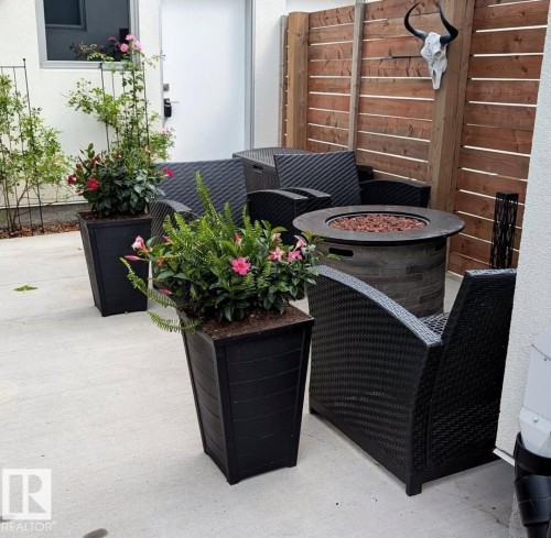 View of patio featuring an outdoor fire pit - 14812 98 Avenue, Edmonton, AB - Outdoor With Exterior
