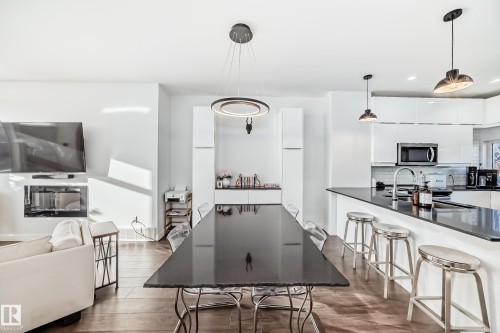 Dining area with wood finished floors and recessed lighting - 14812 98 Avenue, Edmonton, AB - Indoor Photo Showing Kitchen