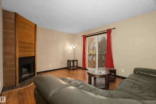 3511 43 Avenue, Edmonton, AB - Indoor Photo Showing Living Room With Fireplace