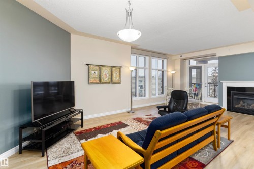 408 9020 Jasper Avenue, Edmonton, AB - Indoor Photo Showing Living Room With Fireplace