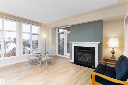 408 9020 Jasper Avenue, Edmonton, AB - Indoor Photo Showing Living Room With Fireplace