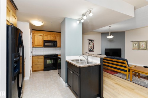 408 9020 Jasper Avenue, Edmonton, AB - Indoor Photo Showing Kitchen With Double Sink