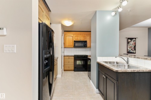 408 9020 Jasper Avenue, Edmonton, AB - Indoor Photo Showing Kitchen With Double Sink