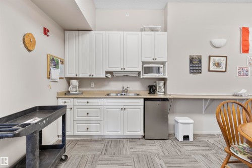 202 4004 47 Street, Drayton Valley, AB - Indoor Photo Showing Kitchen With Double Sink