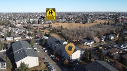 Aerial view of property's location featuring nearby suburban area - 