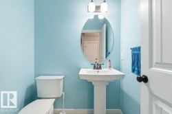 Bathroom featuring toilet and baseboards - 