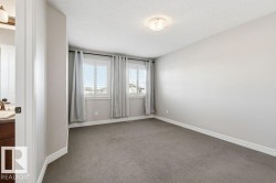 Spare room with carpet flooring and a textured ceiling - 