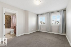 Spare room with a textured ceiling and carpet - 