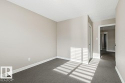 Unfurnished room with carpet floors and a textured ceiling - 