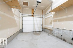 Garage featuring a garage door opener - 