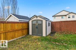 View of shed featuring a fenced backyard - 