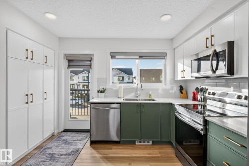 1174 Aster Boulevard, Edmonton, AB - Indoor Photo Showing Kitchen With Stainless Steel Kitchen With Double Sink