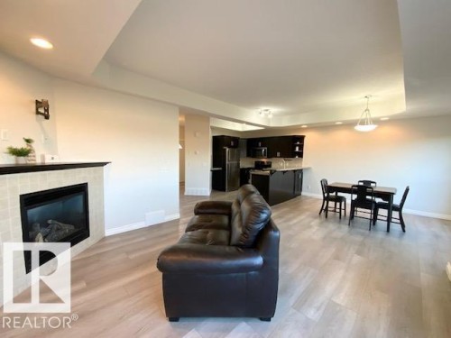 B 4706 57 Avenue, Wetaskiwin, AB - Indoor Photo Showing Living Room With Fireplace