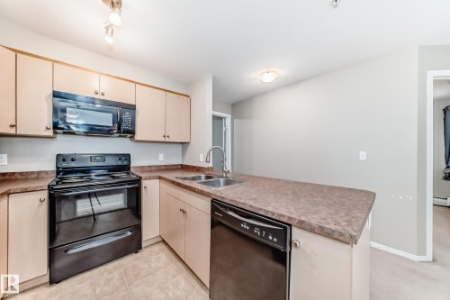 310 4309 33 Street, Stony Plain, AB - Indoor Photo Showing Kitchen With Double Sink