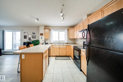 115 4403 23 Street, Edmonton, AB - Indoor Photo Showing Kitchen With Double Sink