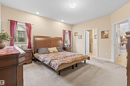 Bedroom with light carpet, a textured ceiling, and recessed lighting - 50 Willow Wood Lane, Stony Plain, AB - Indoor Photo Showing Bedroom