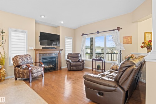 50 Willow Wood Lane, Stony Plain, AB - Indoor Photo Showing Living Room With Fireplace