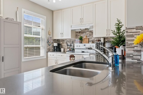 47 1140 Chappelle Blvd, Sw, Edmonton, AB - Indoor Photo Showing Kitchen With Double Sink