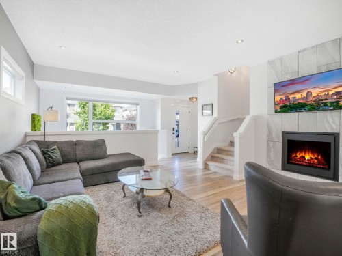 6693 Cardinal Road, Edmonton, AB - Indoor Photo Showing Living Room With Fireplace