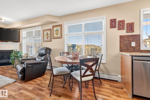 402 6070 Schonsee Way, Edmonton, AB - Indoor With Fireplace