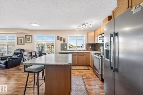 402 6070 Schonsee Way, Edmonton, AB - Indoor Photo Showing Kitchen With Double Sink