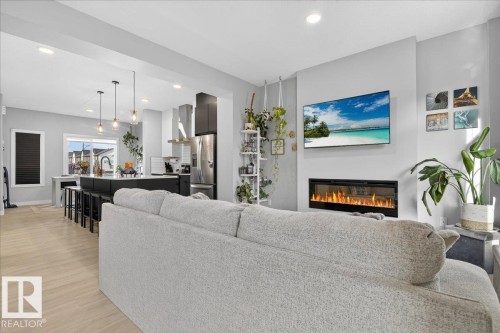 12 6214 Cartmell Court, Edmonton, AB - Indoor Photo Showing Living Room With Fireplace