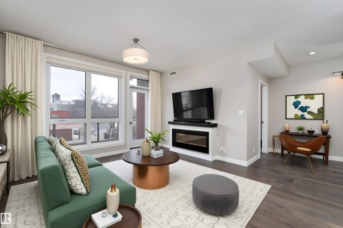 204 11710 87 Avenue, Edmonton, AB - Indoor Photo Showing Living Room With Fireplace