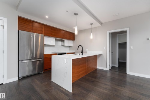 204 11710 87 Avenue, Edmonton, AB - Indoor Photo Showing Kitchen With Stainless Steel Kitchen
