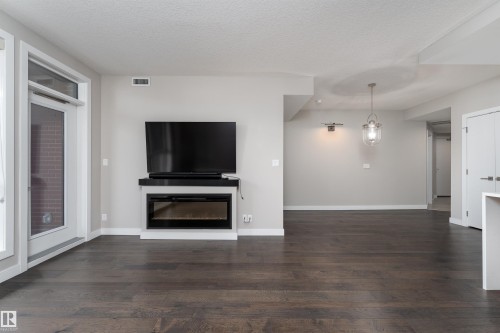 204 11710 87 Avenue, Edmonton, AB - Indoor Photo Showing Living Room With Fireplace