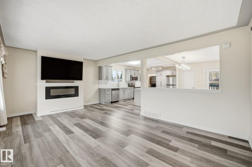 9227 79 Street, Edmonton, AB - Indoor Photo Showing Living Room With Fireplace