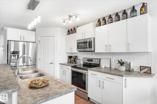17130 7A Avenue, Edmonton, AB - Indoor Photo Showing Kitchen With Double Sink With Upgraded Kitchen