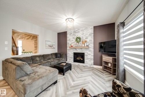 5927 6 Avenue, Edmonton, AB - Indoor Photo Showing Living Room With Fireplace