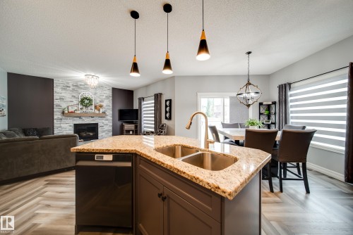 5927 6 Avenue, Edmonton, AB - Indoor Photo Showing Kitchen With Fireplace With Double Sink