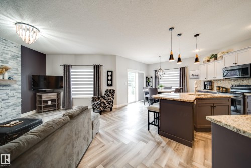 5927 6 Avenue, Edmonton, AB - Indoor Photo Showing Other Room With Fireplace