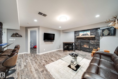 5927 6 Avenue, Edmonton, AB - Indoor Photo Showing Living Room With Fireplace