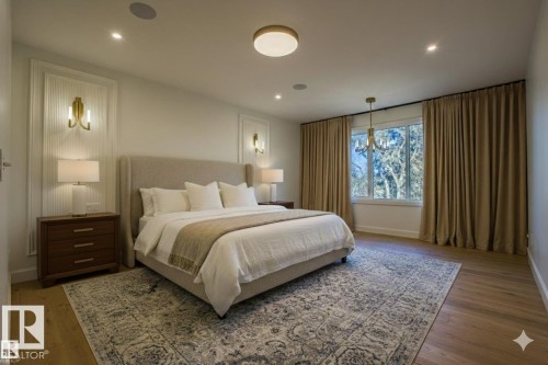 Bedroom featuring light wood-style floors and recessed lighting. picture has been virtually staged - 12304 39 Avenue, Edmonton, AB - Indoor Photo Showing Bedroom