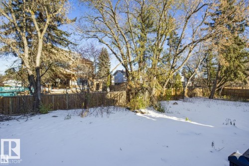 Yard layered in snow with a fenced backyard - 12304 39 Avenue, Edmonton, AB - Outdoor