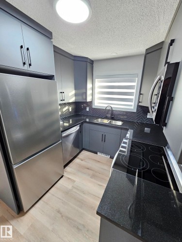 Edmonton, AB - Indoor Photo Showing Kitchen