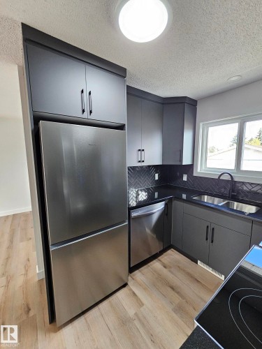 Edmonton, AB - Indoor Photo Showing Kitchen With Double Sink