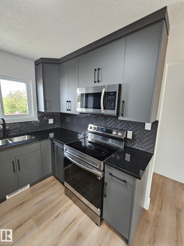Edmonton, AB - Indoor Photo Showing Kitchen With Double Sink