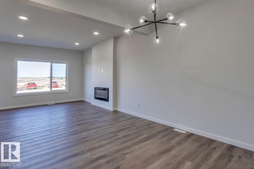8 Chartres Close, St. Albert, AB - Indoor Photo Showing Other Room With Fireplace