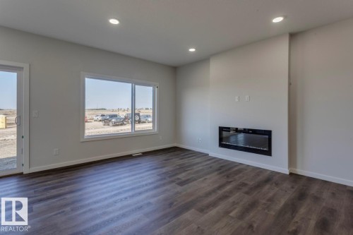 8 Chartres Close, St. Albert, AB - Indoor Photo Showing Living Room With Fireplace