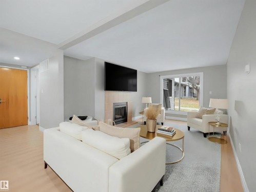104 18008 62B Avenue, Edmonton, AB - Indoor Photo Showing Living Room With Fireplace
