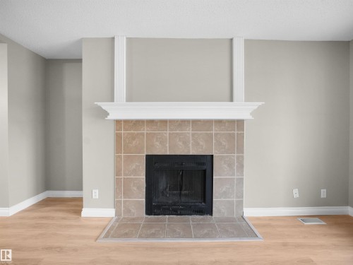 104 18008 62B Avenue, Edmonton, AB - Indoor Photo Showing Living Room With Fireplace
