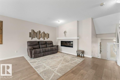 2104 Price Landing Landing, Edmonton, AB - Indoor Photo Showing Living Room With Fireplace