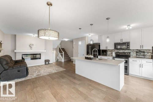 2104 Price Landing Landing, Edmonton, AB - Indoor Photo Showing Kitchen With Fireplace With Upgraded Kitchen
