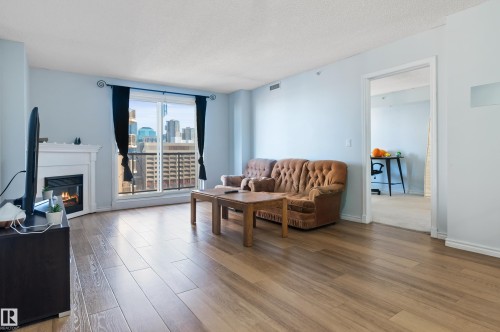 1102 10909 103 Avenue, Edmonton, AB - Indoor Photo Showing Living Room With Fireplace