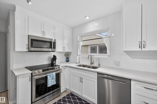 7719 71 Avenue, Edmonton, AB - Indoor Photo Showing Kitchen With Double Sink With Upgraded Kitchen