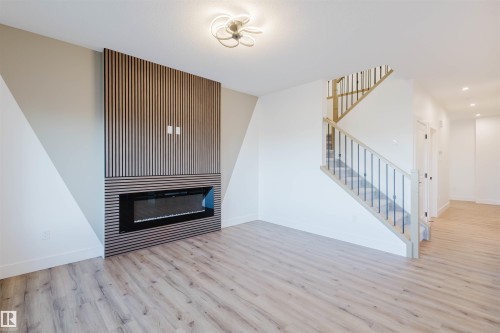 339 Munn Way, Leduc, AB - Indoor Photo Showing Other Room With Fireplace